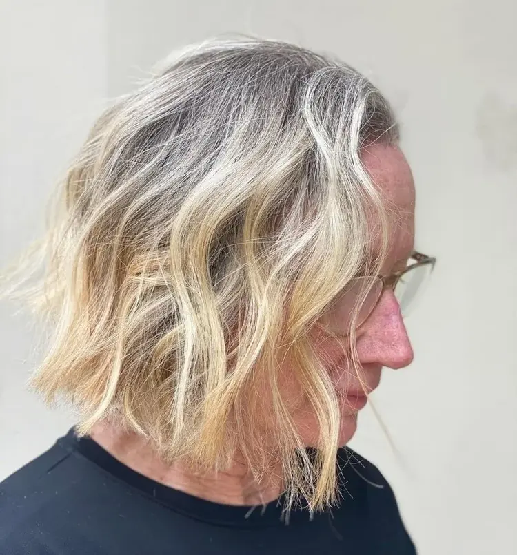 blonde hair over 50 with dark roots short haircut