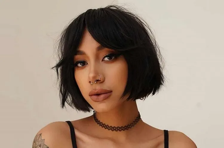 bob cut and curtain bangs for more youthful appearance and volume