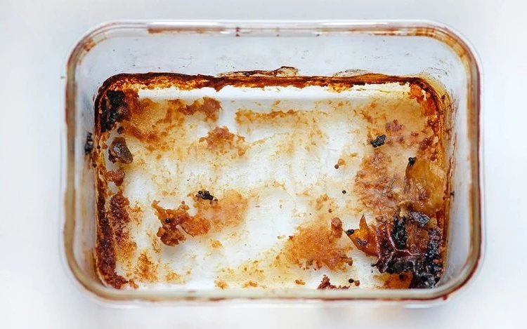 burnt glass baking dish can be cleaned with white vinegar