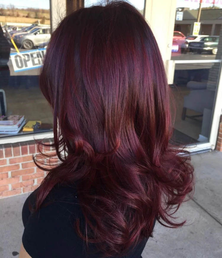 cherry cola spring hair colors 2023 long wavy hair