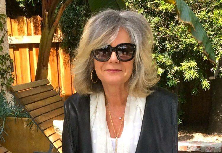 gorgeous gray wavy shoulder length hairstyle with bangs