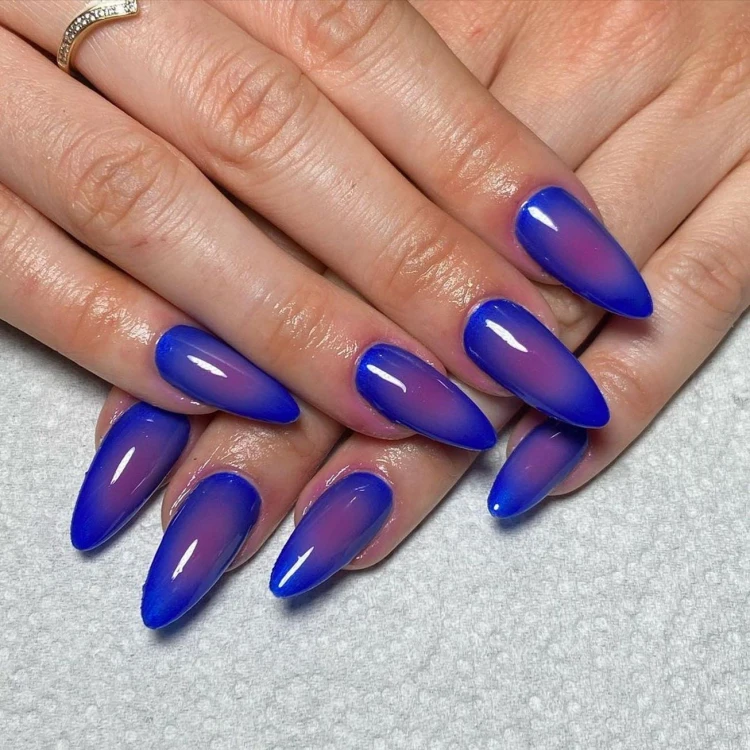 gradient manicure in darker shades midnight blue and purple
