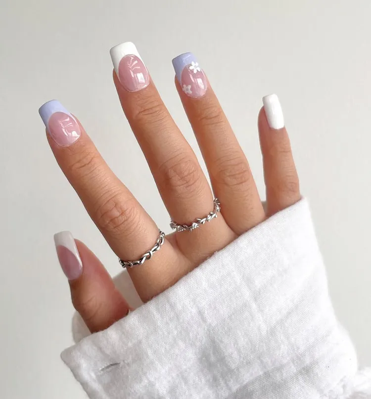 lavender and white design on squoval nails