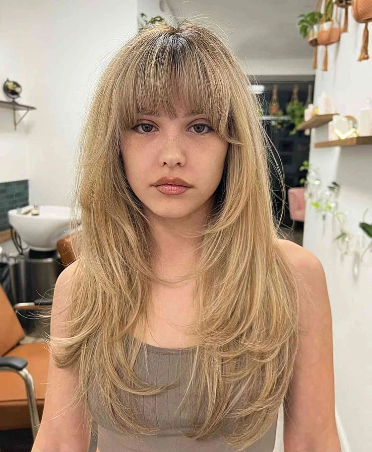 long c cut with thick bangs blonde hair