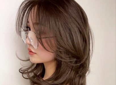 long bangs that blend in with the rest of the layers of the hair