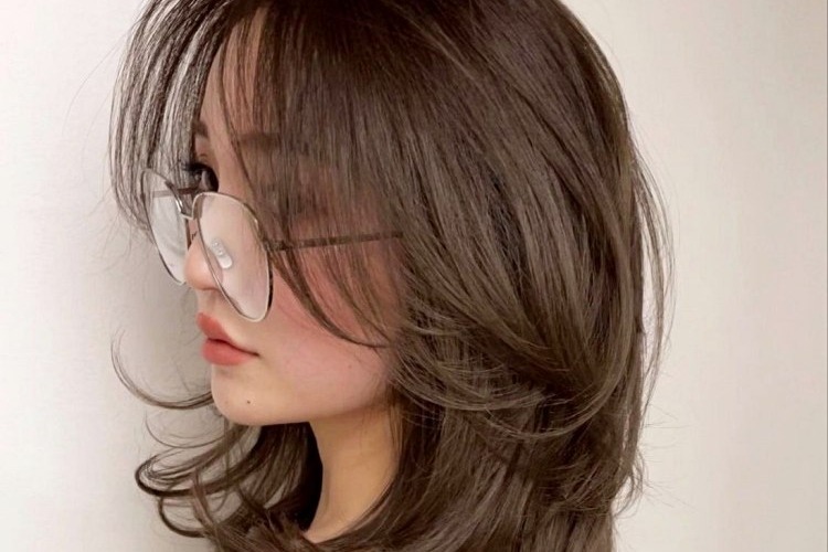 long bangs that blend in with the rest of the layers of the hair