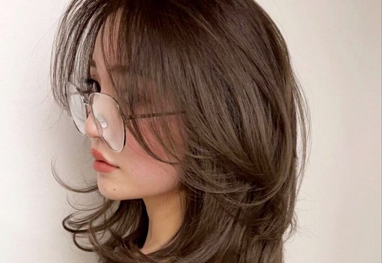 long bangs that blend in with the rest of the layers of the hair