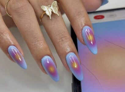 manicure idea that depicts aura's glow in blue purple and yellow