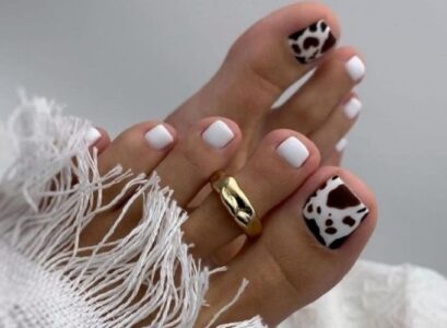 minimalist black and white animal print trendy pedicure spring toenail designs