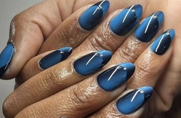 ocean blue and black long oval illusion french nails inspo