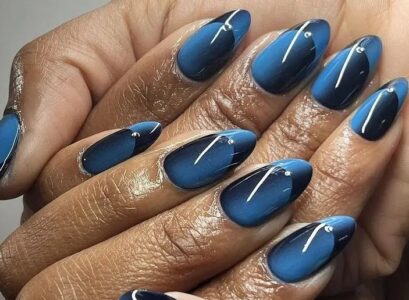 ocean blue and black long oval illusion french nails inspo