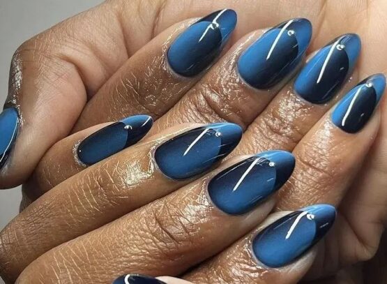 ocean blue and black long oval illusion french nails inspo