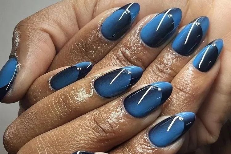 ocean blue and black long oval illusion french nails inspo