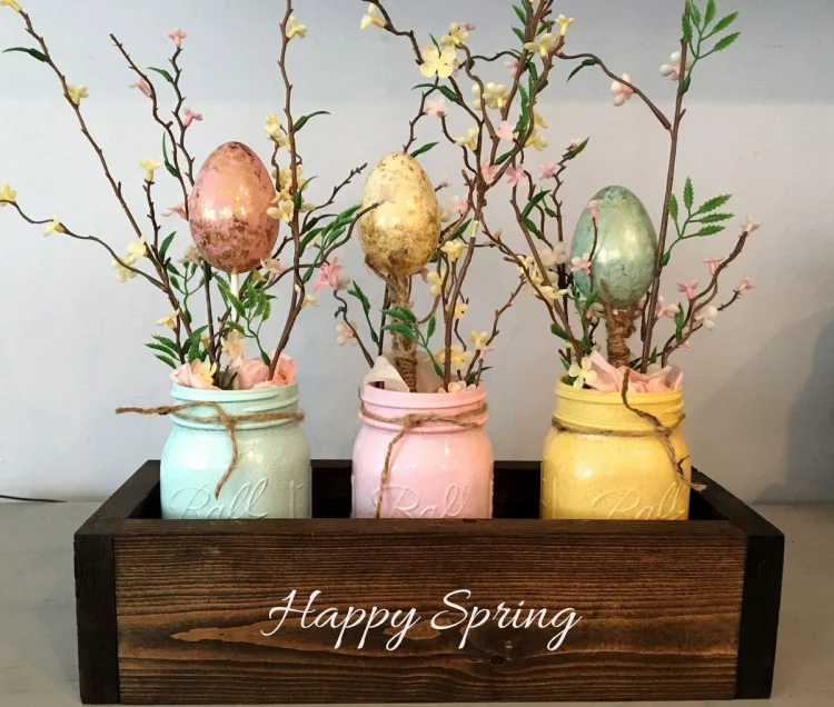 painted mason jars with twigs and decorative eggs