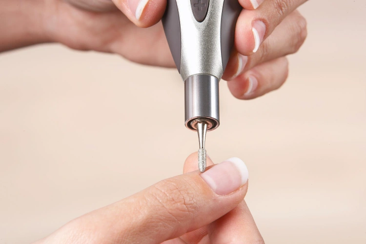 peeling off cuticles using an e-file professional tools