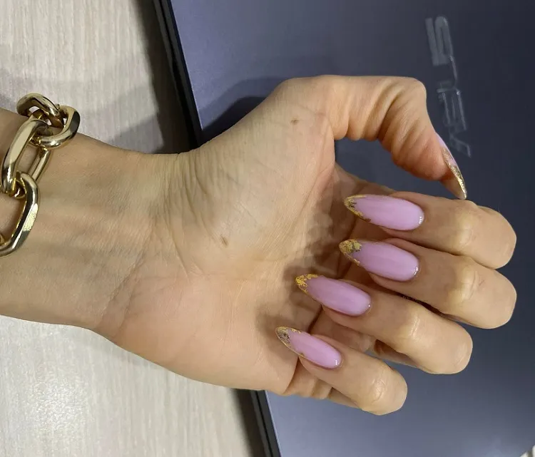pink nails with gold foil decoration spring manicure 2023