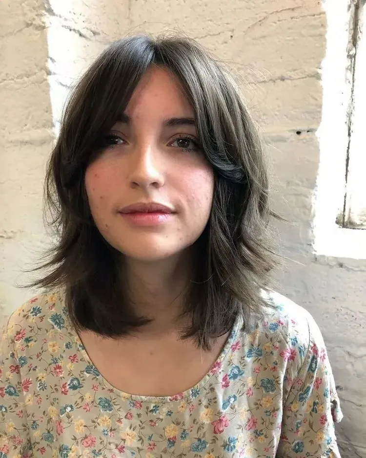 short layered hairstyle for women with bangs