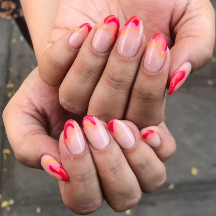 spring-nail-colors-2023-french-tips-red-pink-orange-swirly-trendy-fashion-week-new-york-inspo