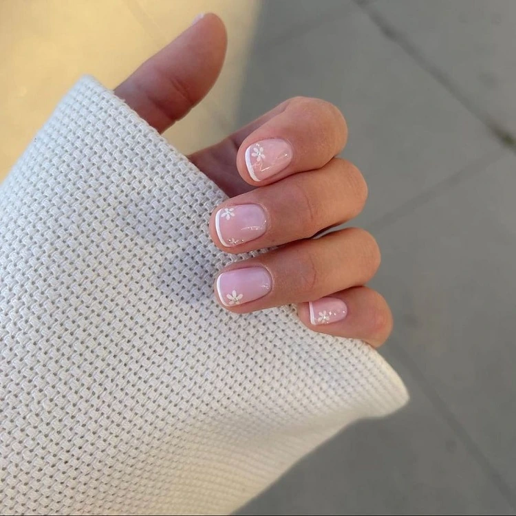 yellow french manicure, sparkles on short square nails closeup on a white  background Stock Photo | Adobe Stock