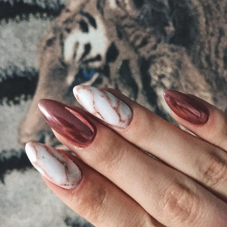 stunning white marble and metallic nail design
