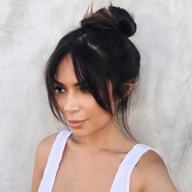 top knot hairstyle with bangs
