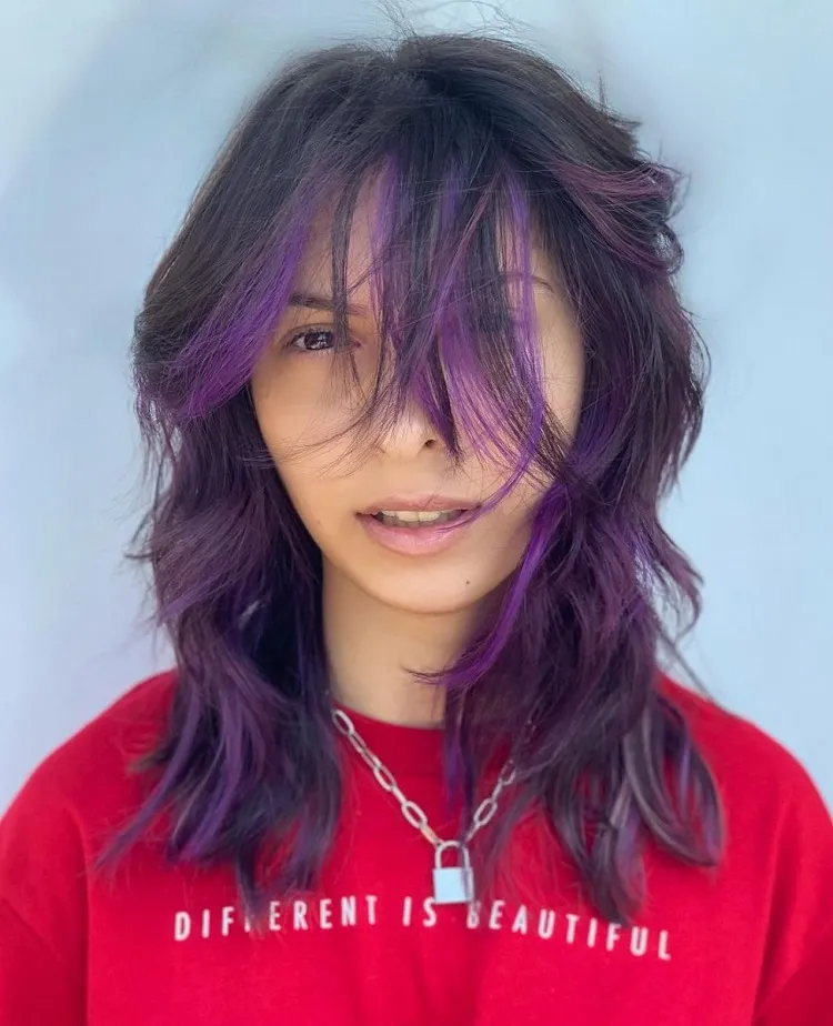 wolf cut with purple streaks wavy hair