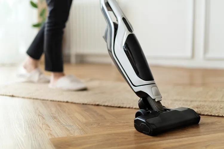 cleaning parquet wood floors with vacuum cleaner with a hardwood cleaning attachment