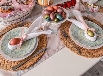 easter table set up bunny napkins easter eggs and pastry