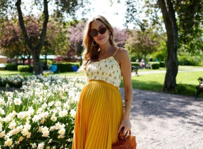 high waist pleated skirt and crop top yellow colors maternity outfit ideas