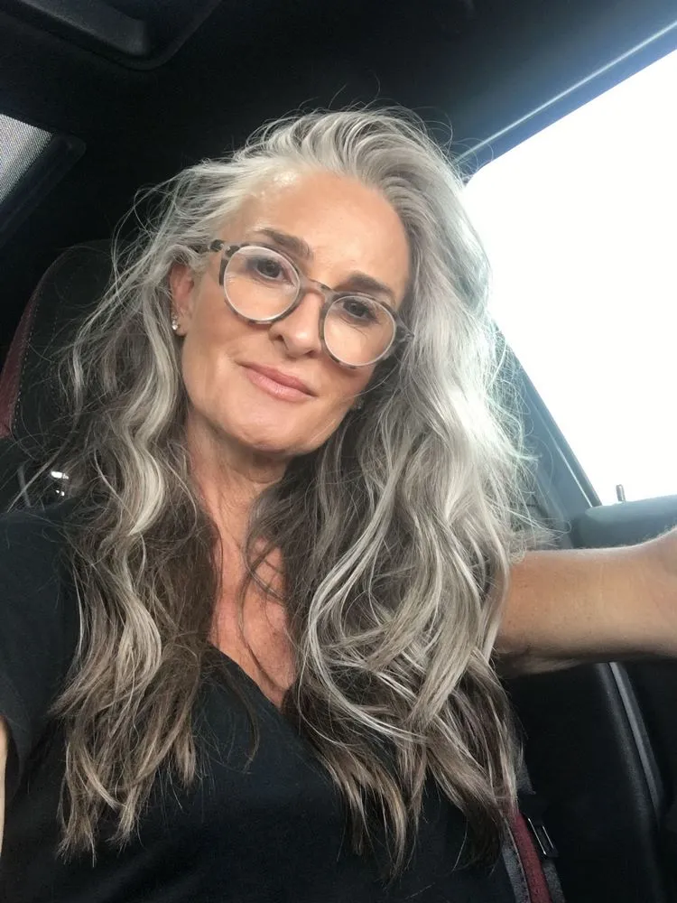 long gray hairstyles for women over 50 soft waves