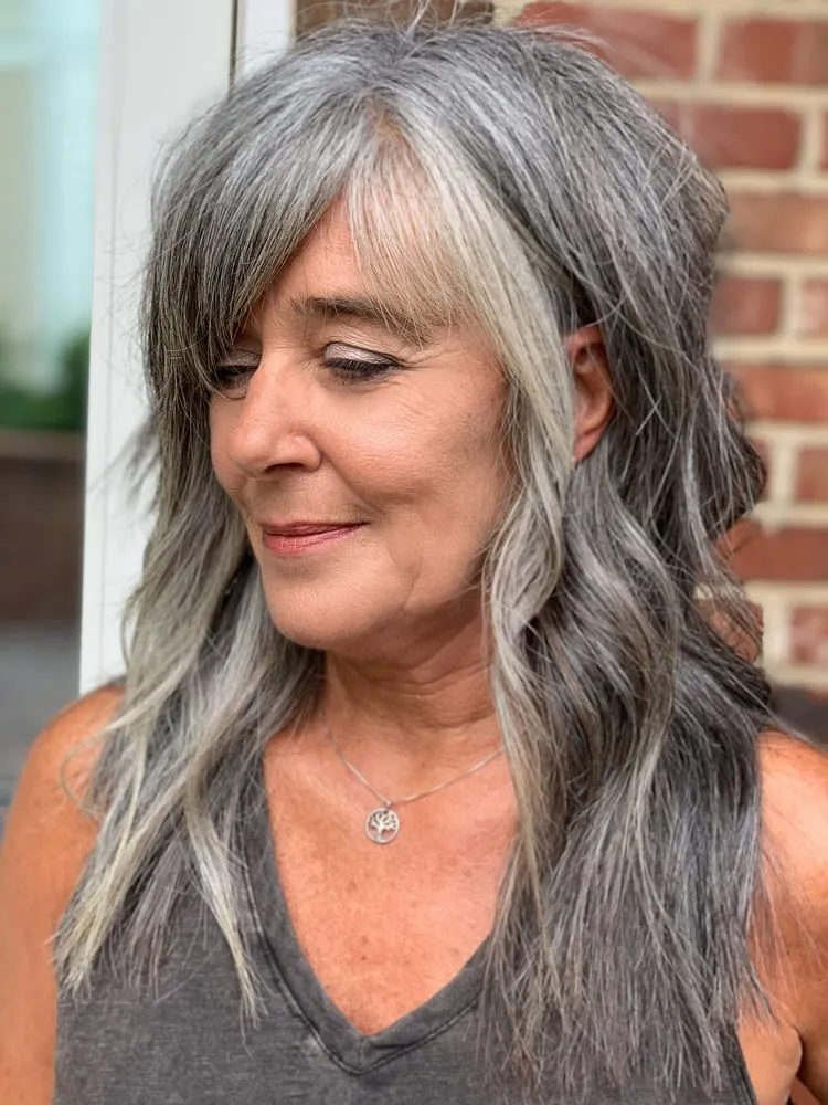 long shag haircut for women over 50 with long gray hair