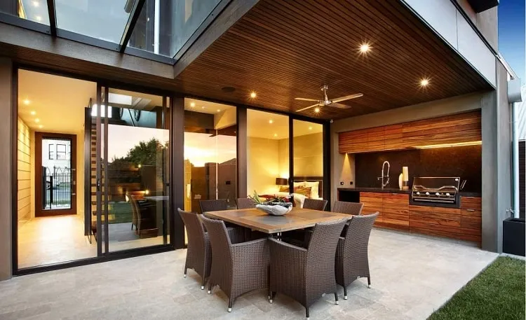 modern porch with rattan furniture and bbq