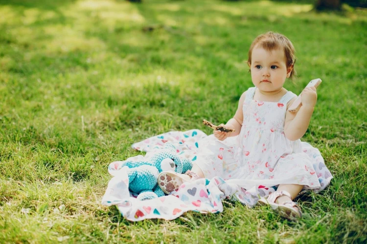 adorable toddler in a cute dress outdoor photography idea