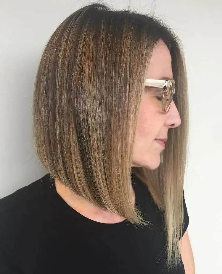 asymmetrical bob for women over 40 with glasses