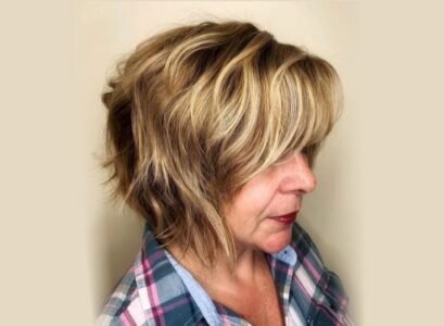 blonde balayage choppy bob with bangs for women over 60