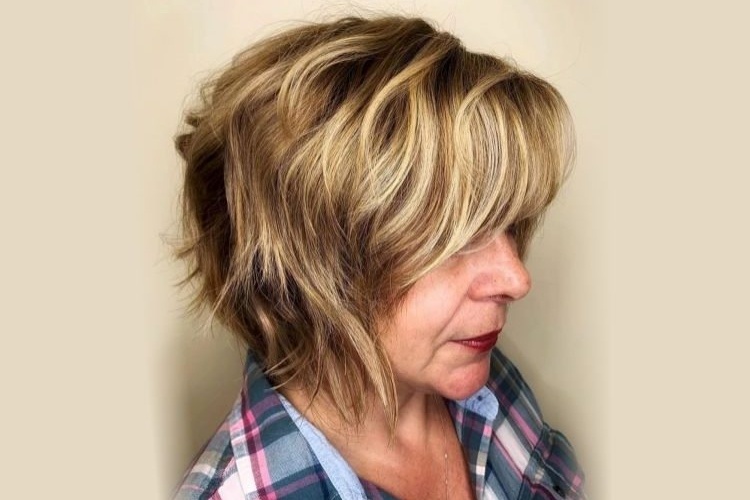 blonde balayage choppy bob with bangs for women over 60