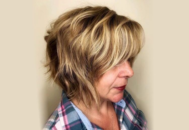 blonde balayage choppy bob with bangs for women over 60