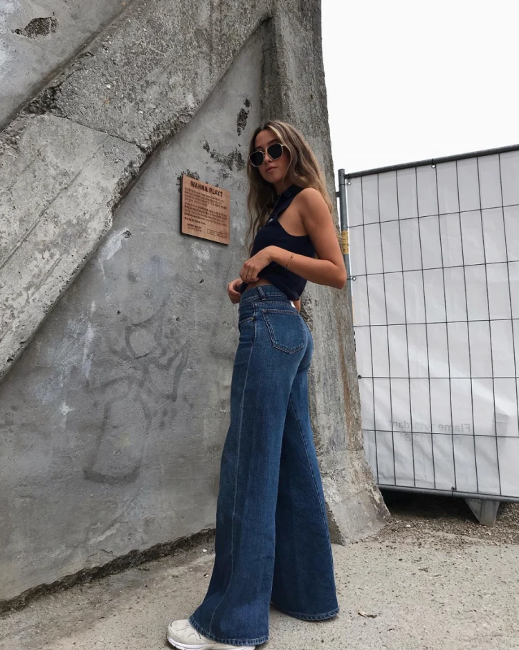 blue wide leg jeans and black crop top