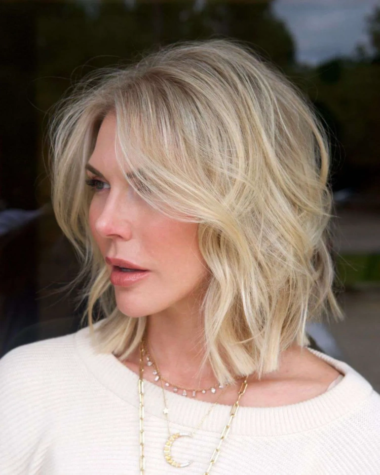 blunt cut short hair for women over 50 gorgeous waves and long curtain bangs