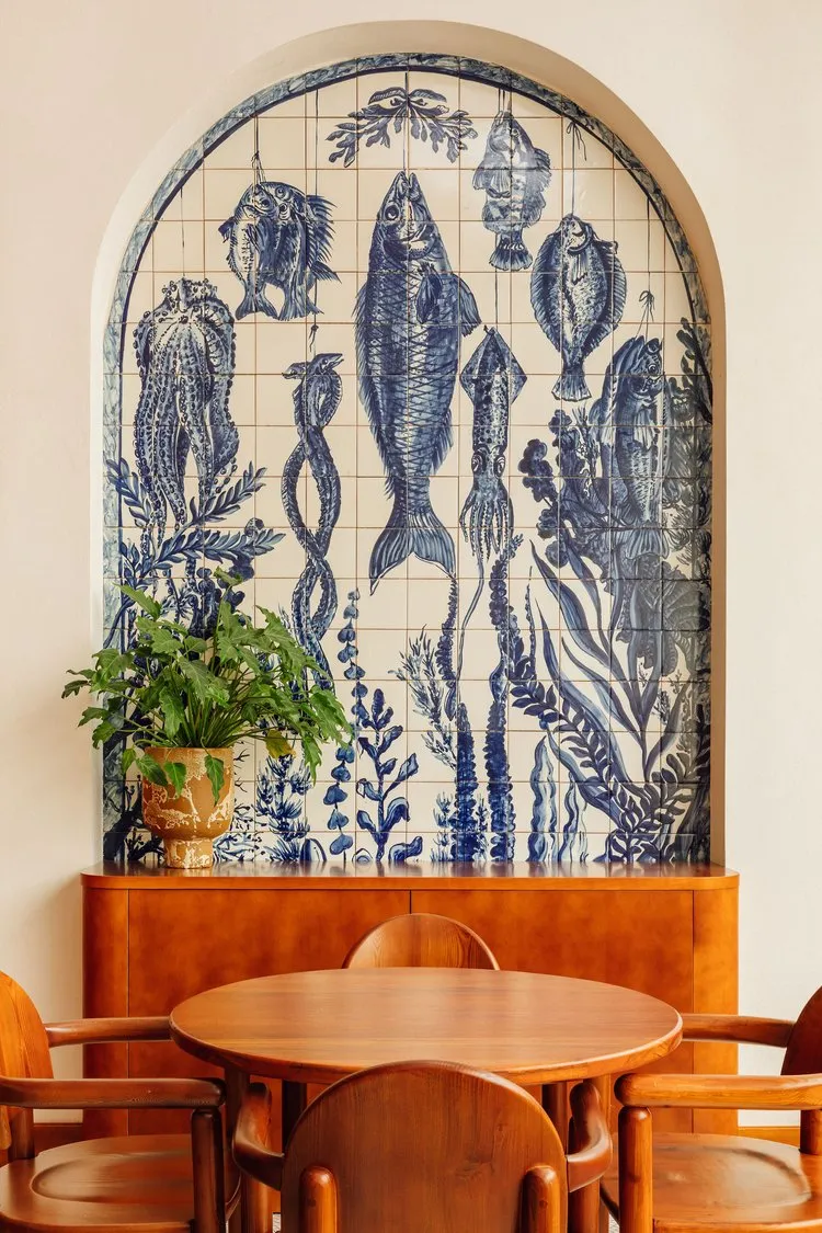 contemporary design seafood theme drawings azulejo tiles restaurant interior design accent wall arch nook