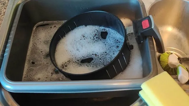 easy air fryer cleaning hack brushing wint dish soap