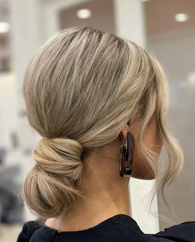 elegant blonde low bun with highlights how to do professional highlights