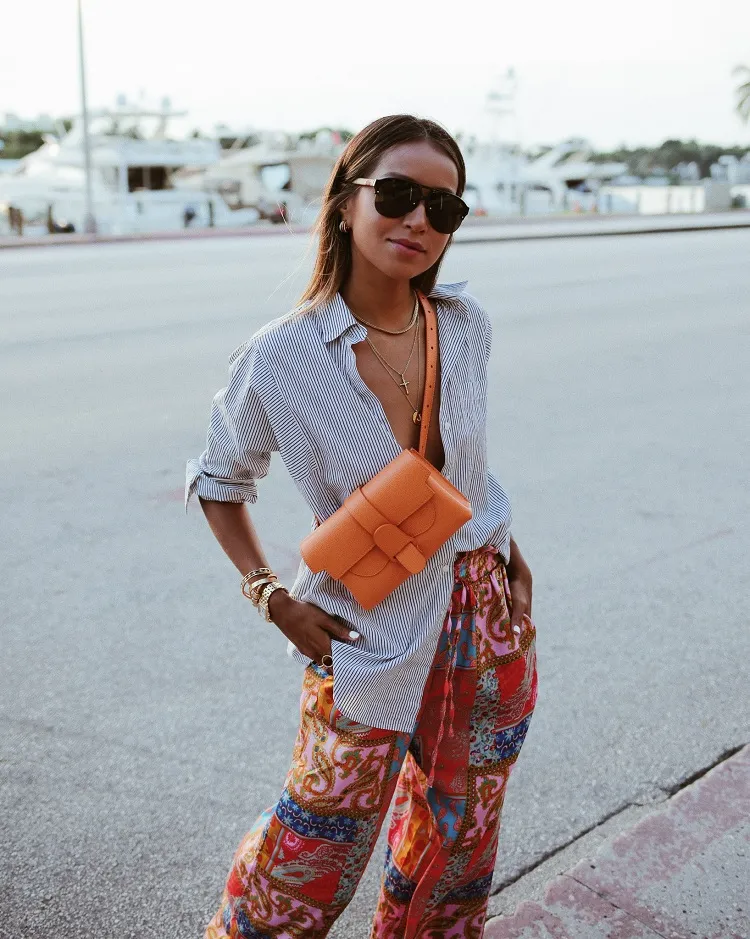 envelope belt bag across chest vibrant orange coachella outfit ideas 2023