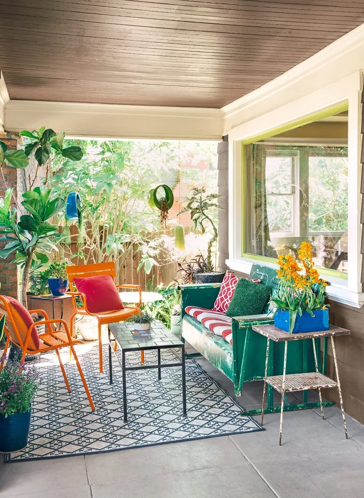 front patio bold bright colors mismatched furniture greenery patterns
