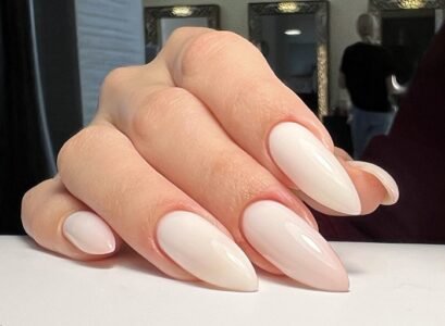 glossy milky white long elegant minimalist stiletto nails design