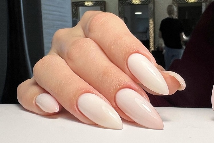 glossy milky white long elegant minimalist stiletto nails design