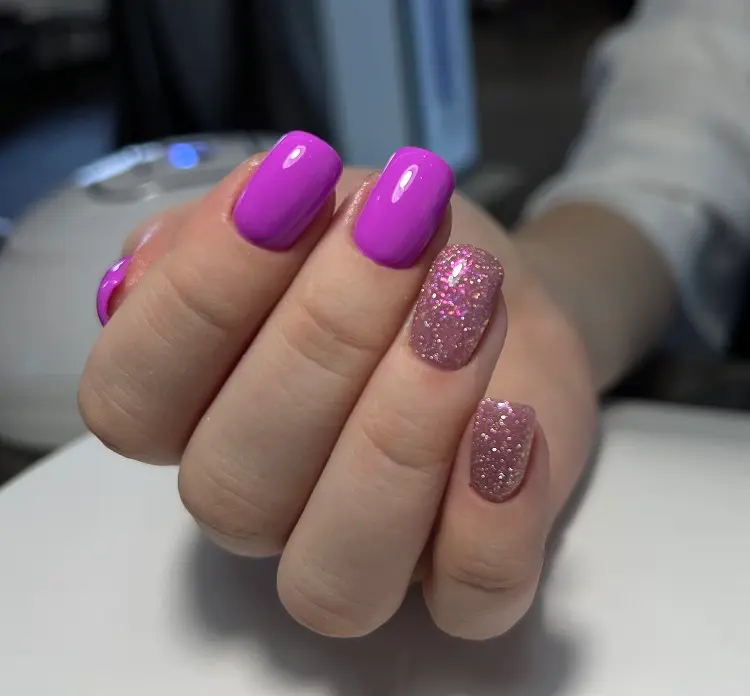 hot pink with glitter manicure for women over 50