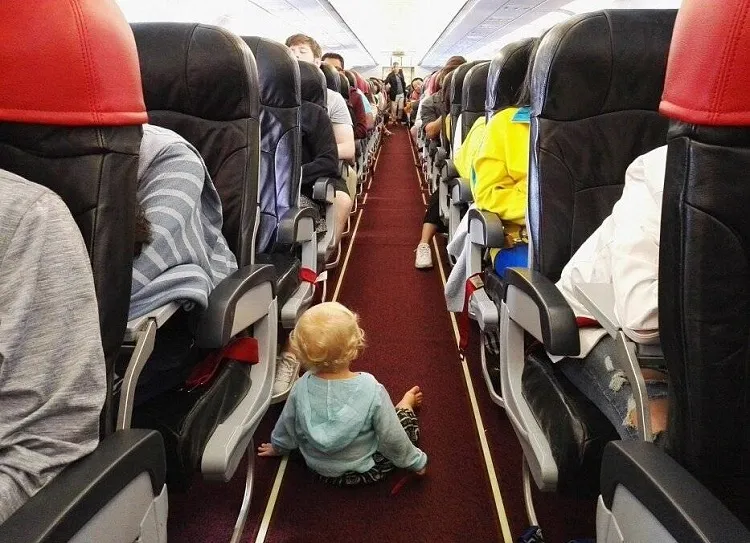 how to calm a crying baby on a plane give them a walk between the seats