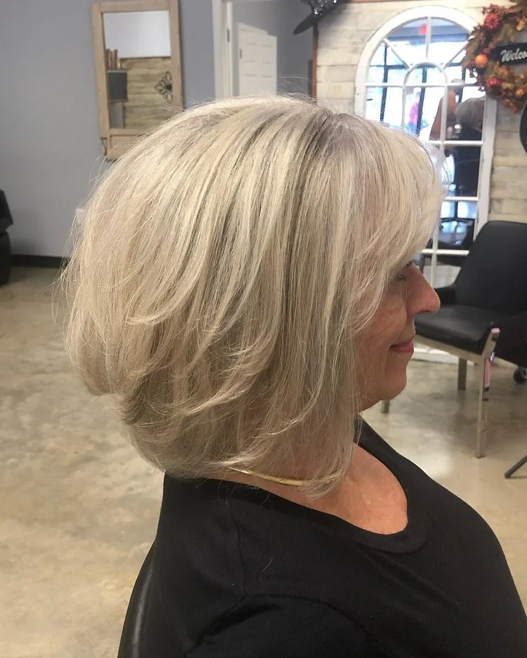 inverted lob side swept bangs medium length layered hairstyle for over 60