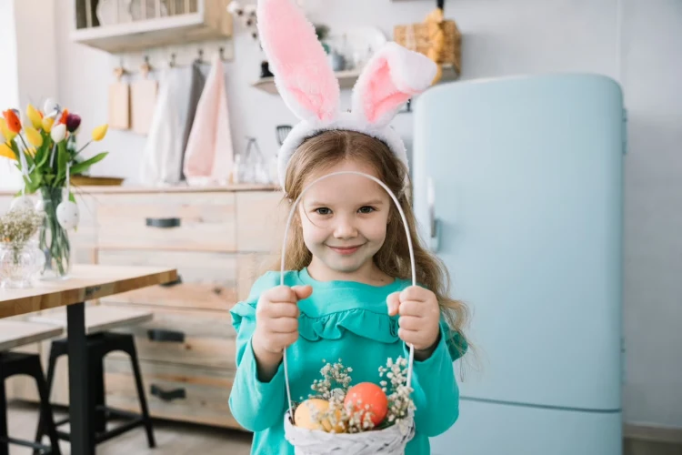 little girl with bunny ears holding a basket cute long sleeve blue dress